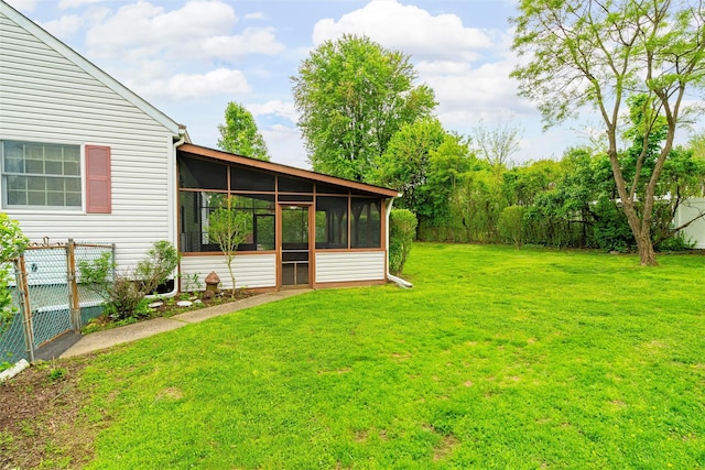 view of yard featuring a sunroom