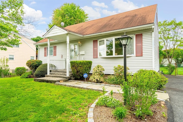 view of front of home featuring a shingled roof