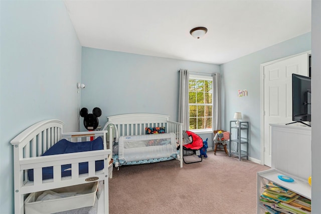 bedroom with carpet and baseboards