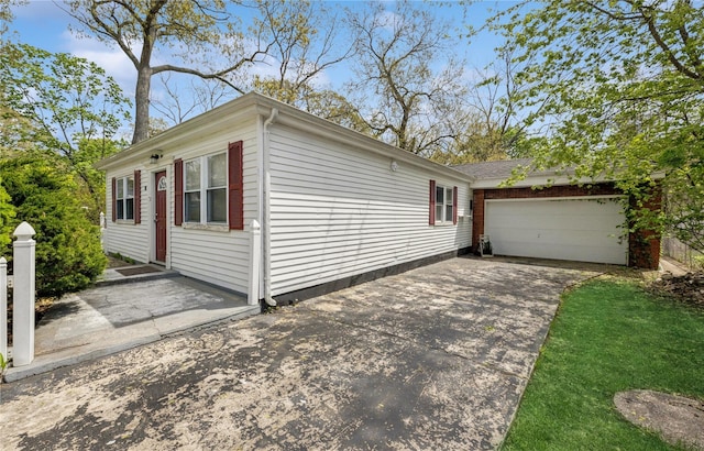 54 Oakdale Ave, Selden, NY 11784 - view of property exterior featuring driveway and a garage