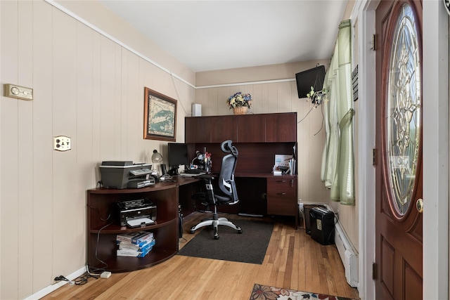office area featuring light wood-style flooring and baseboard heating