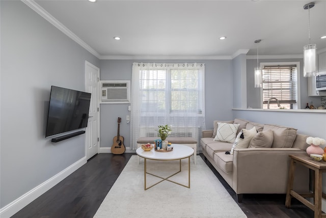 living area featuring dark wood-type flooring, baseboards, an AC wall unit, recessed lighting, and ornamental molding