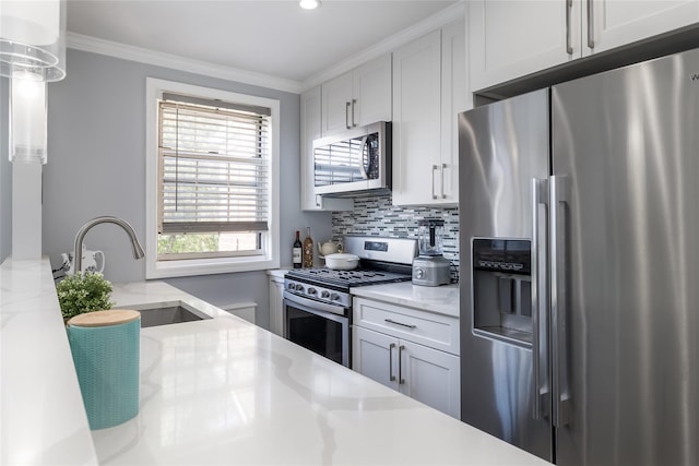 kitchen with appliances with stainless steel finishes, a sink, decorative backsplash, ornamental molding, and light stone counters