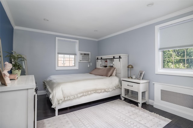 bedroom with multiple windows, dark wood-style flooring, a wall unit AC, baseboards, and crown molding