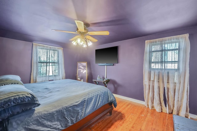 66 Elmwood Ave, Hempstead, NY 11550 - bedroom with wood finished floors, ceiling fan, and baseboards