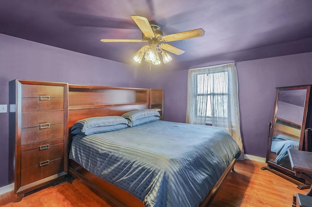 66 Elmwood Ave, Hempstead, NY 11550 - bedroom with wood finished floors, baseboards, and a ceiling fan