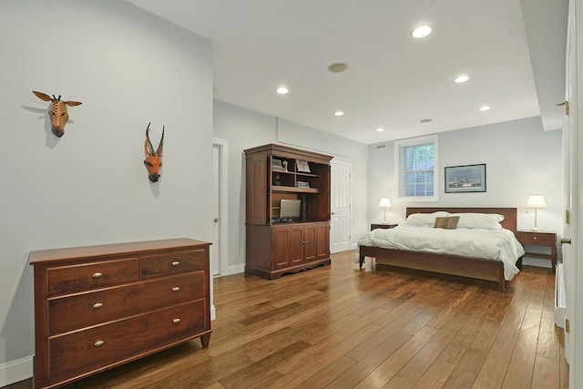 1988 Beekman Ct, Yorktown Heights, NY 10598 - bedroom featuring dark wood-style floors, recessed lighting, and baseboards