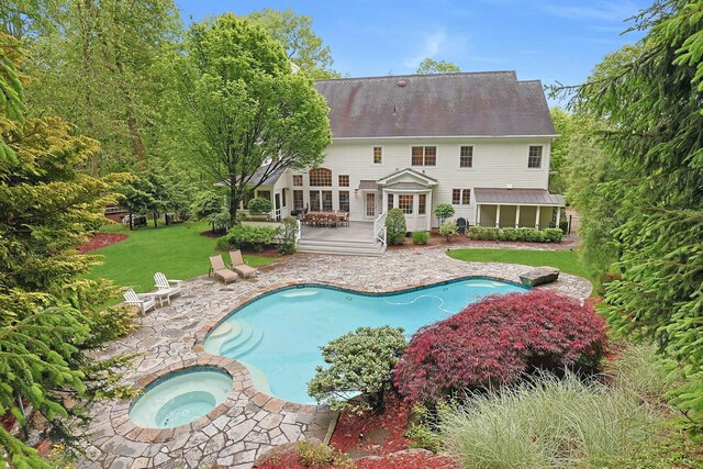 1988 Beekman Ct, Yorktown Heights, NY 10598 - swimming pool featuring an in-ground hot tub, a wooden deck, a patio, and a yard