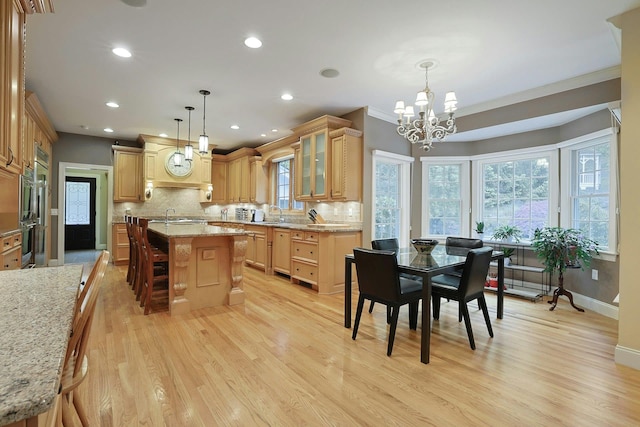 1988 Beekman Ct, Yorktown Heights, NY 10598 - kitchen featuring a chandelier, light wood-type flooring, decorative backsplash, glass insert cabinets, and recessed lighting