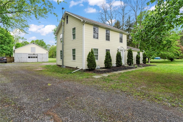 5105-5103 Rte 82, Salt Point, NY 12578 - view of home's exterior with a garage, an outbuilding, and a lawn