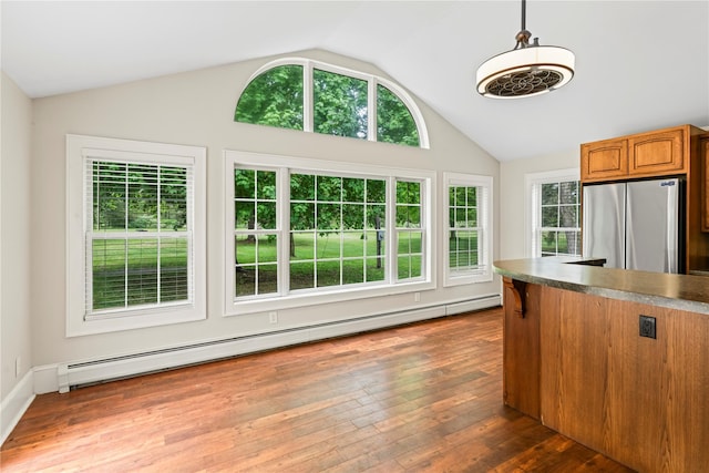 5105-5103 Rte 82, Salt Point, NY 12578 - kitchen with freestanding refrigerator, a baseboard radiator, vaulted ceiling, brown cabinetry, and dark wood-style floors