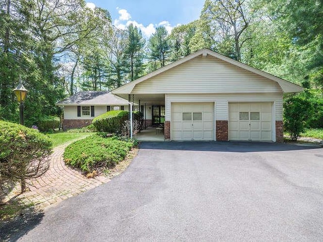 36 Lisa Dr, Dix Hills, NY 11746 - ranch-style home with brick siding and a garage