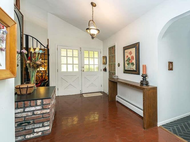 36 Lisa Dr, Dix Hills, NY 11746 - entrance foyer with a baseboard heating unit, arched walkways, vaulted ceiling, baseboards, and french doors