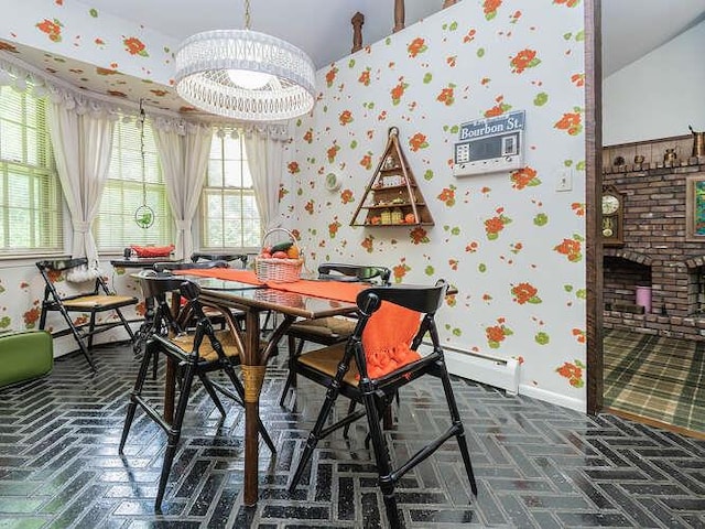 36 Lisa Dr, Dix Hills, NY 11746 - dining space with a chandelier, baseboards, a fireplace, and baseboard heating