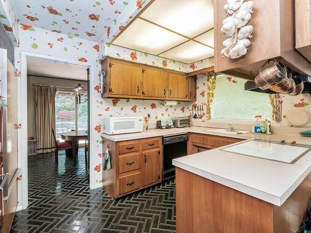 36 Lisa Dr, Dix Hills, NY 11746 - kitchen with white appliances, wallpapered walls, brown cabinets, light countertops, and a sink