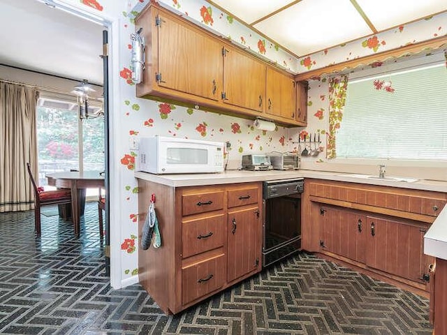 36 Lisa Dr, Dix Hills, NY 11746 - kitchen featuring white microwave, dishwasher, light countertops, a sink, and brown cabinetry