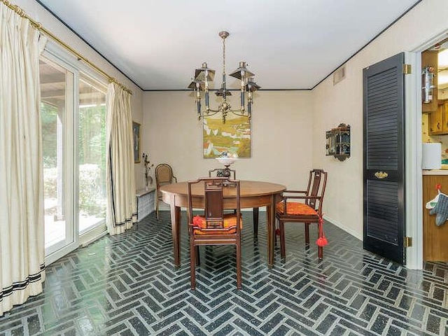 36 Lisa Dr, Dix Hills, NY 11746 - dining area featuring brick patterned flooring, a chandelier, and baseboards