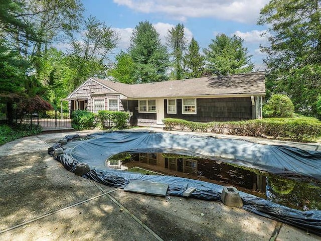 36 Lisa Dr, Dix Hills, NY 11746 - view of swimming pool featuring a covered pool and fence