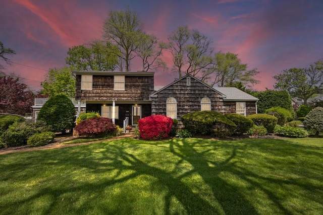 view of front of house with a yard