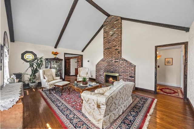 living room with hardwood / wood-style flooring, a fireplace, beam ceiling, high vaulted ceiling, and baseboards