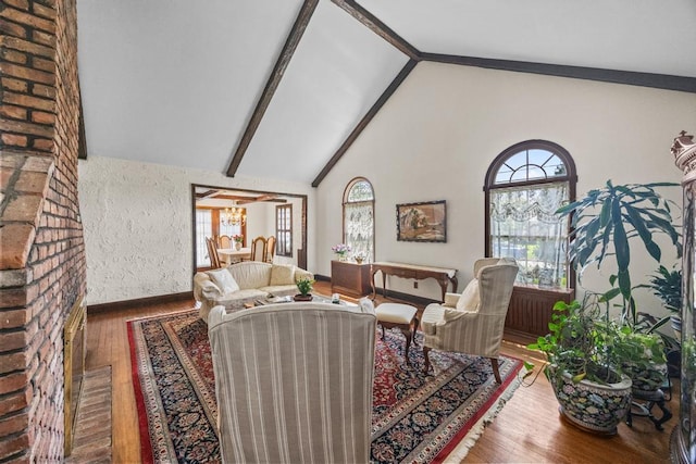 living room featuring baseboards, wood finished floors, beamed ceiling, and high vaulted ceiling