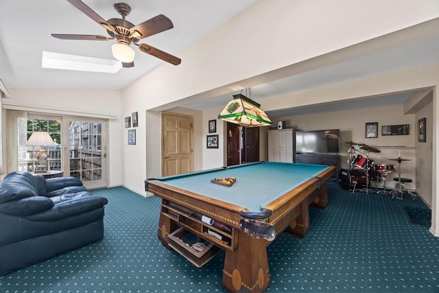 rec room featuring carpet floors, vaulted ceiling, a ceiling fan, a skylight, and pool table