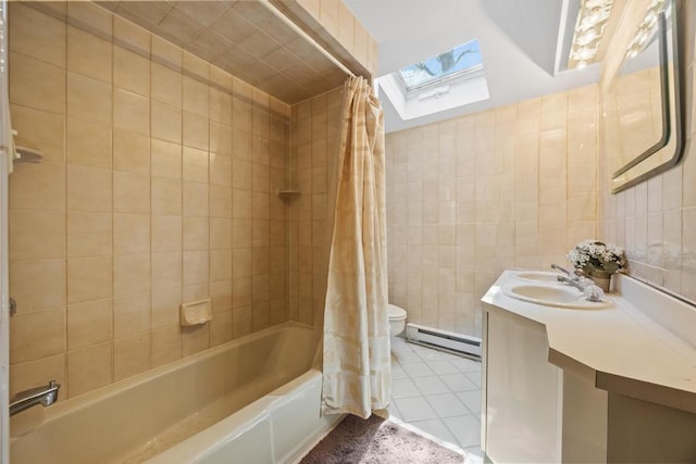bathroom with a baseboard radiator, a skylight, shower / bath combo, toilet, and tile walls