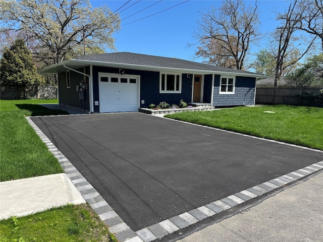 9 Henry St, Wyandanch, NY 11798 - ranch-style home featuring an attached garage, asphalt driveway, and roof with shingles