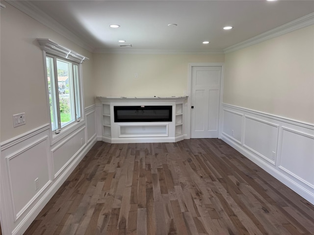 9 Henry St, Wyandanch, NY 11798 - unfurnished living room featuring a glass covered fireplace, a decorative wall, a wainscoted wall, crown molding, and dark wood-style flooring