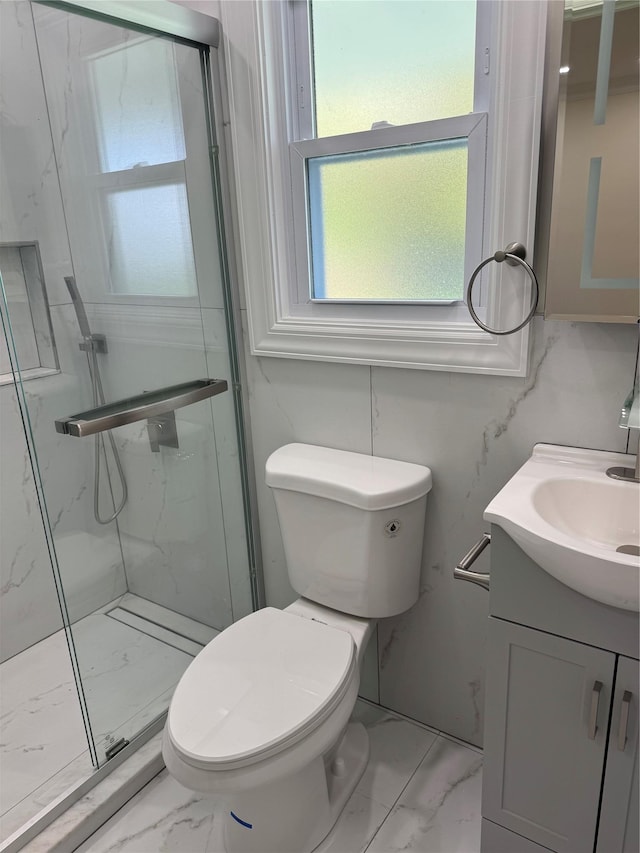 9 Henry St, Wyandanch, NY 11798 - bathroom featuring marble look tiles, a marble finish shower, toilet, and vanity