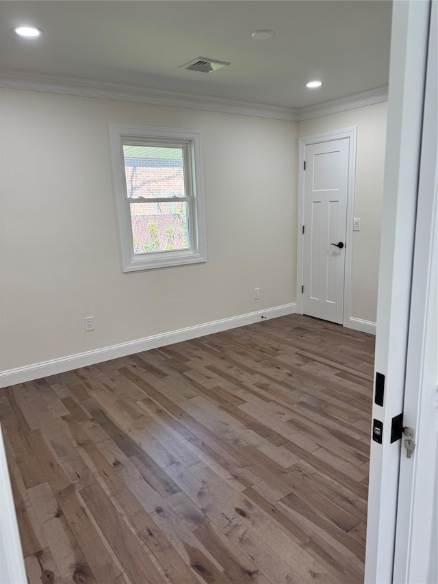 9 Henry St, Wyandanch, NY 11798 - empty room with ornamental molding, wood finished floors, recessed lighting, and baseboards