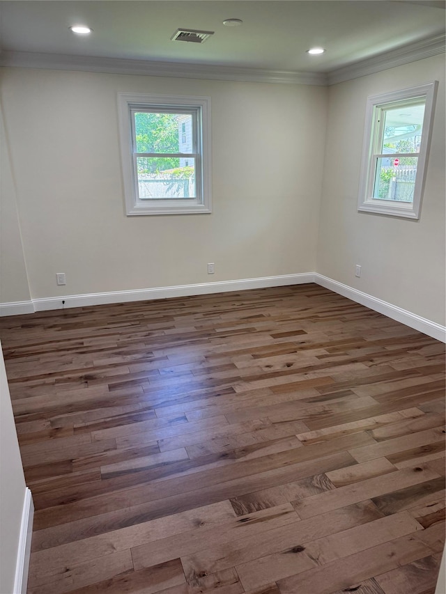 9 Henry St, Wyandanch, NY 11798 - empty room with crown molding, wood finished floors, baseboards, and recessed lighting
