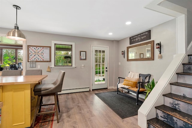45 Proctor Rd, Eldred, NY 12732 - doorway to outside with a baseboard radiator, healthy amount of natural light, stairs, light wood-style flooring, and recessed lighting