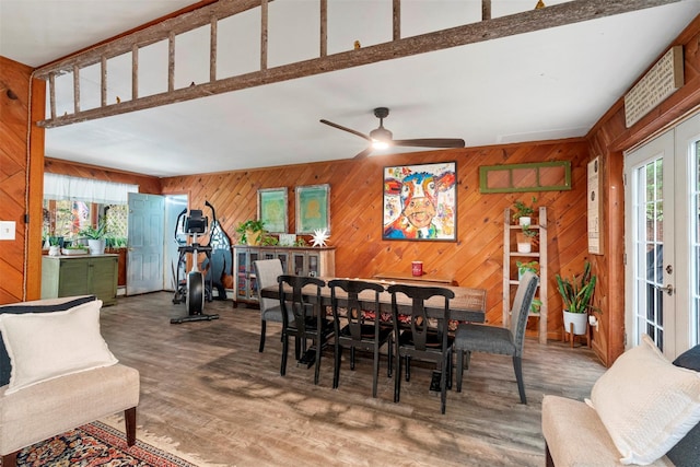 45 Proctor Rd, Eldred, NY 12732 - dining space with ceiling fan, wood finished floors, and wood walls