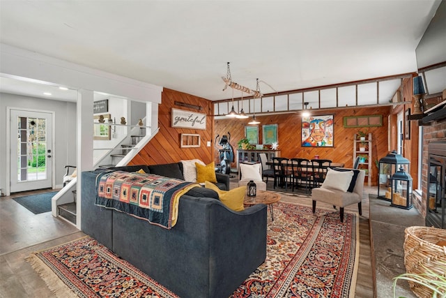 45 Proctor Rd, Eldred, NY 12732 - living area featuring wood walls, stairway, and wood finished floors