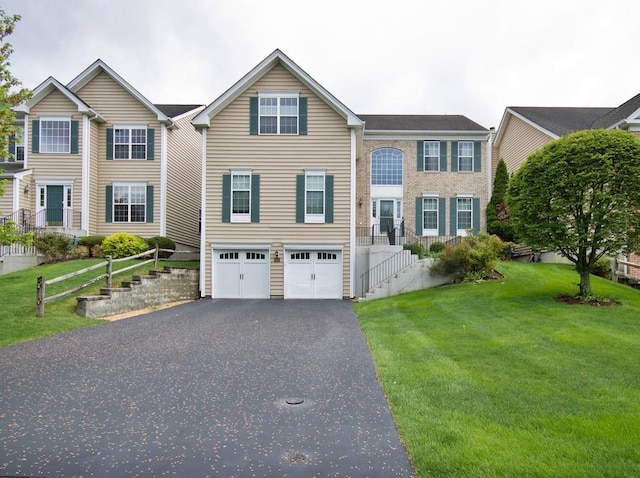 622 Creekside Ln, Fishkill, NY 12524 - view of front of property with driveway, an attached garage, stairway, and a front lawn