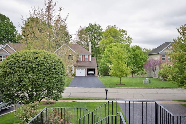 622 Creekside Ln, Fishkill, NY 12524 - view of grassy yard featuring an attached garage and asphalt driveway