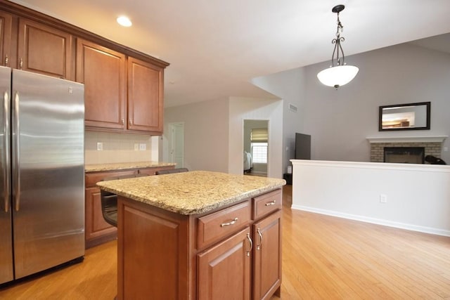 622 Creekside Ln, Fishkill, NY 12524 - kitchen featuring stainless steel refrigerator, light wood-type flooring, a center island, pendant lighting, and recessed lighting