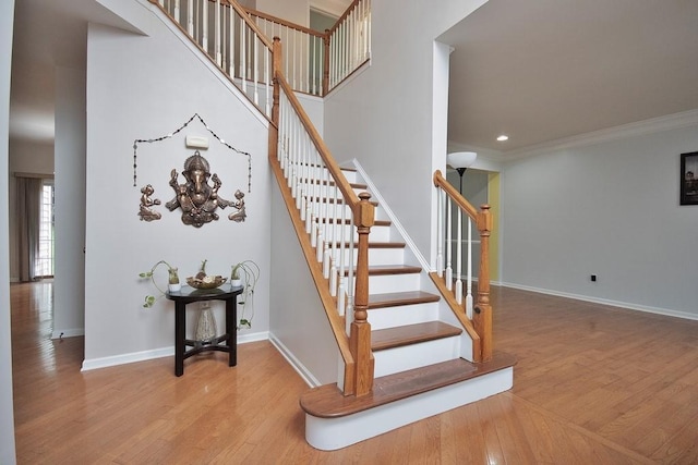 622 Creekside Ln, Fishkill, NY 12524 - stairway with wood finished floors, baseboards, crown molding, and recessed lighting