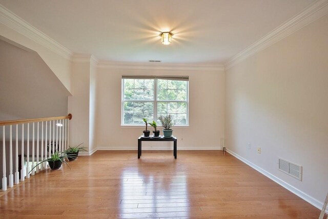 622 Creekside Ln, Fishkill, NY 12524 - unfurnished room featuring light wood-style flooring, crown molding, and baseboards