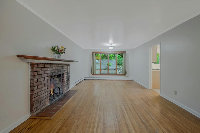 155 Woodbury Rd, Huntington, NY 11743 - unfurnished living room with wood finished floors, a fireplace, crown molding, baseboards, and a baseboard radiator