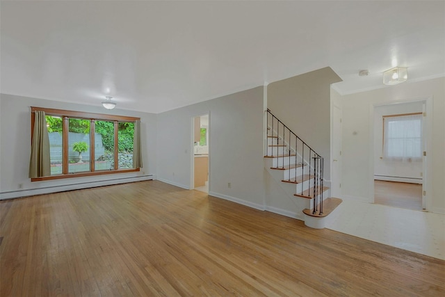 155 Woodbury Rd, Huntington, NY 11743 - unfurnished living room with baseboard heating, light wood-type flooring, a baseboard radiator, stairs, and baseboards