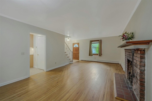155 Woodbury Rd, Huntington, NY 11743 - unfurnished living room featuring baseboard heating, stairway, a fireplace, light wood-type flooring, and baseboards