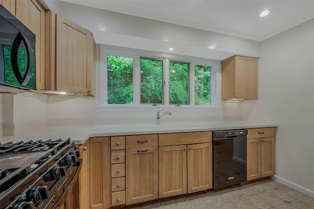 155 Woodbury Rd, Huntington, NY 11743 - kitchen with black appliances, light countertops, baseboards, a sink, and recessed lighting