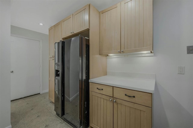 155 Woodbury Rd, Huntington, NY 11743 - kitchen featuring black fridge, light brown cabinets, light countertops, baseboards, and recessed lighting