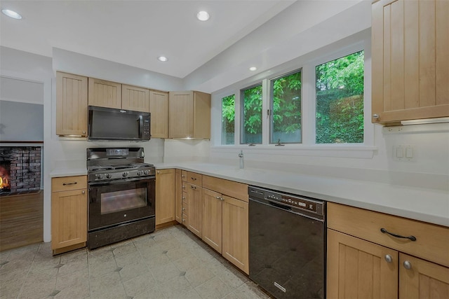 155 Woodbury Rd, Huntington, NY 11743 - kitchen with black appliances, light brown cabinetry, a sink, light countertops, and recessed lighting