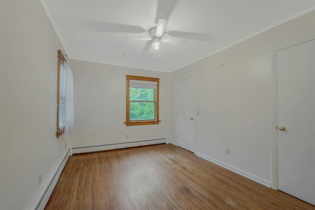 155 Woodbury Rd, Huntington, NY 11743 - unfurnished room with a baseboard heating unit, a ceiling fan, wood finished floors, ornamental molding, and baseboards