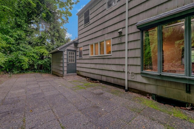 155 Woodbury Rd, Huntington, NY 11743 - view of side of property with a patio