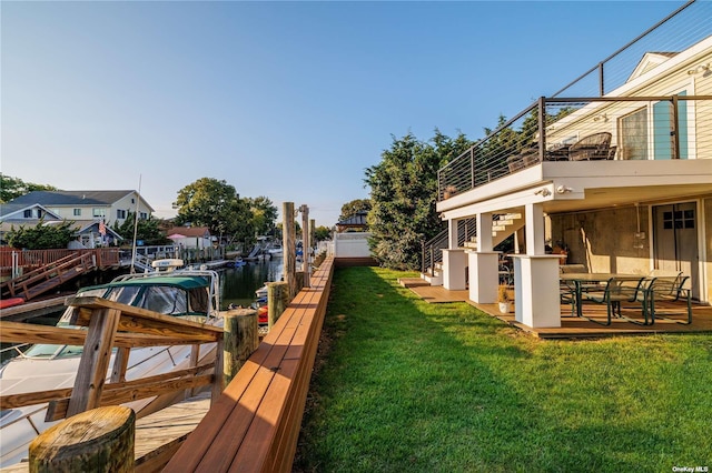 dock area featuring stairway and a balcony