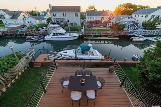 dock featuring a residential view and a water view